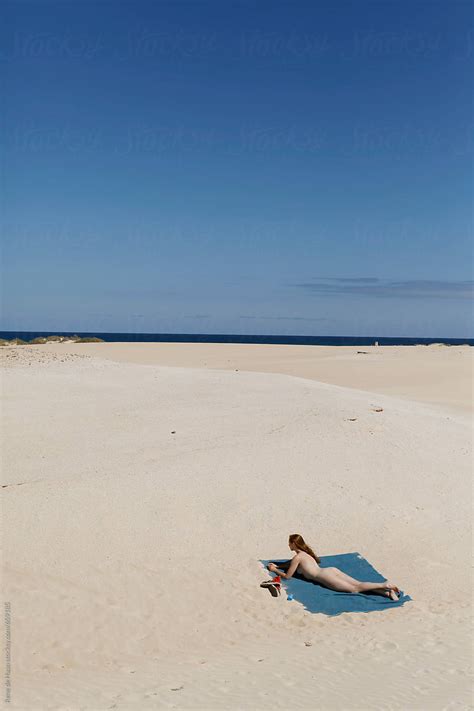 Stunning tanned bikini blonde nude at beach. . Nude girl on beach